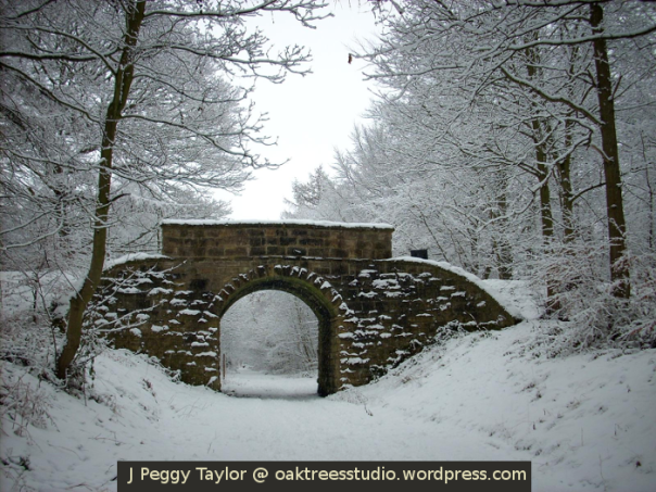 Victorian railway bridge in snow